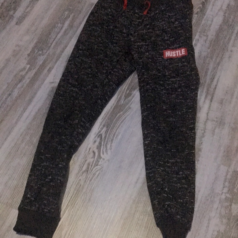 I am selling these black and sort of red sweats